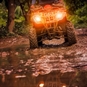 Quad driving through Mud